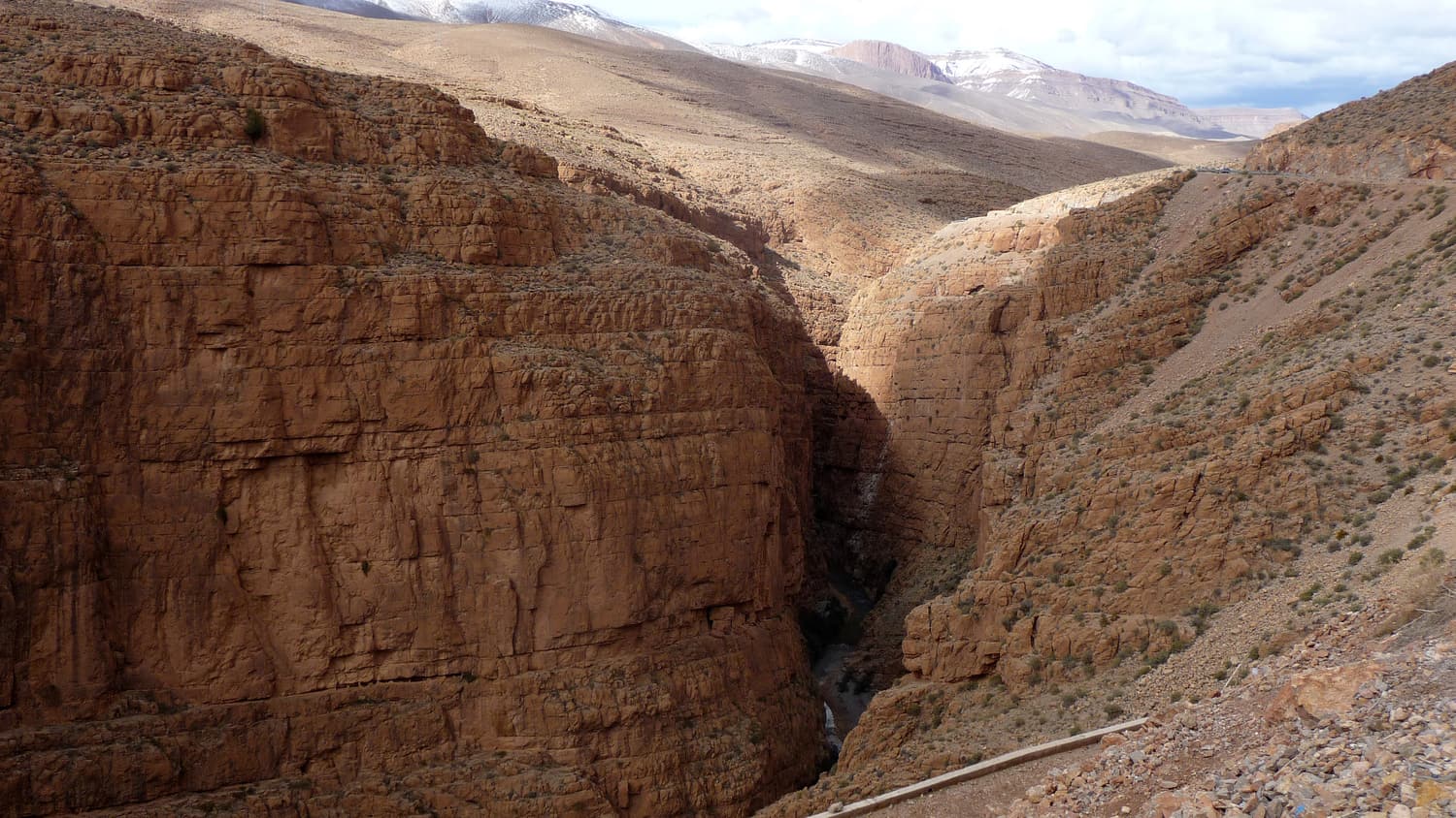 Red cliffs rising above the road through the Dades gorge